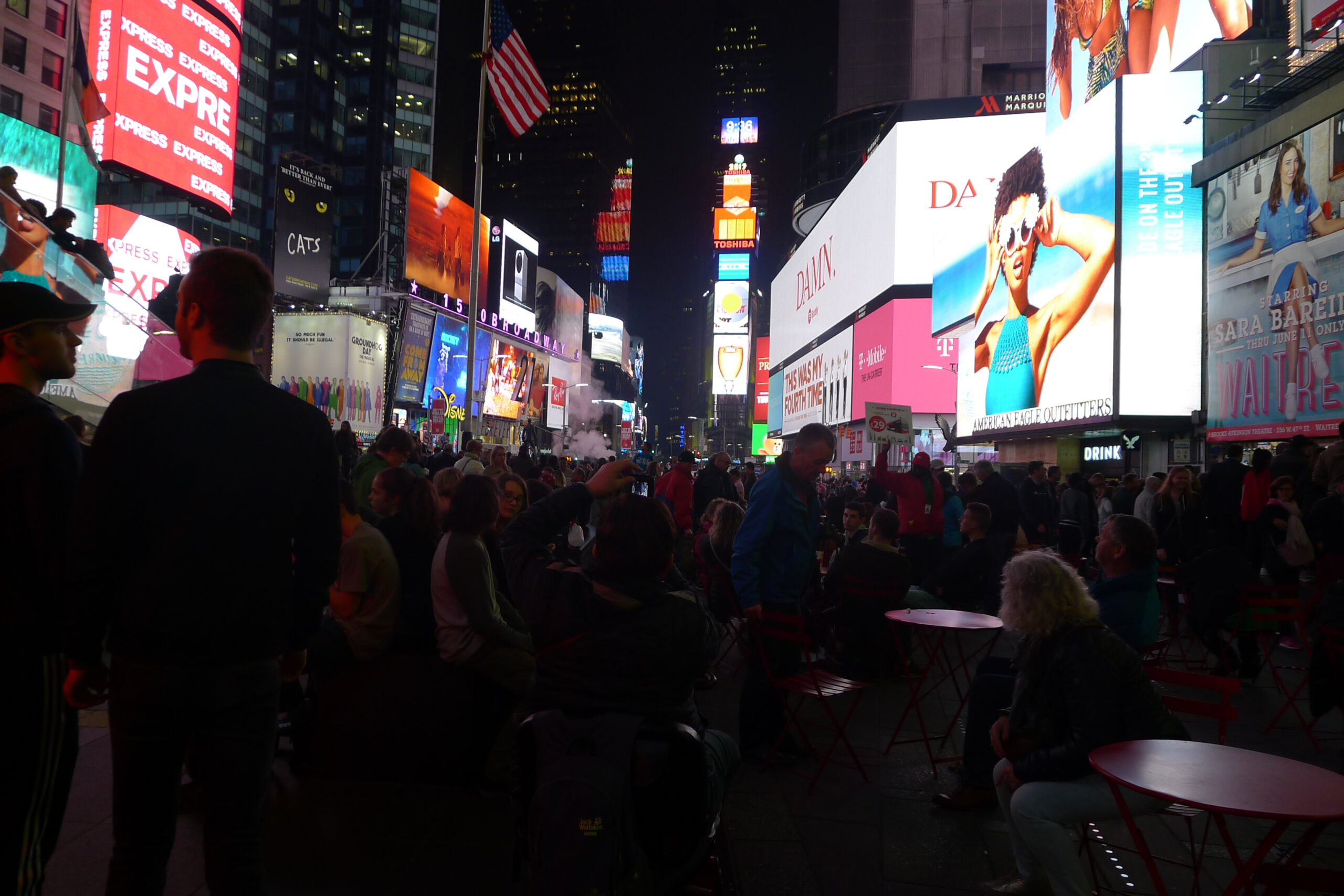 Times Quare with a row of buildings: Food in New York post